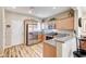 Modern kitchen with stainless steel appliances, granite countertops, and light wood cabinets at 3307 Forestina Ct, Las Vegas, NV 89122