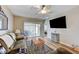 Bright living room featuring wood floors, ceiling fan, and access to the backyard patio at 3307 Forestina Ct, Las Vegas, NV 89122