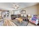 Spacious living area with wood flooring, comfortable seating, and a seamless flow to the kitchen at 3307 Forestina Ct, Las Vegas, NV 89122