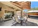 Covered patio with dining table, sliding glass door access, and a hot tub under a charming gazebo at 3307 Forestina Ct, Las Vegas, NV 89122