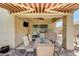 Covered patio featuring a dining area, ceiling fan, and access to a beautifully hardscaped backyard at 3307 Forestina Ct, Las Vegas, NV 89122