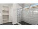 Modern bathroom features sleek glass-enclosed shower with designer tile and a walk-in closet at 344 Tigullio Ave, Henderson, NV 89011