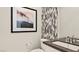 Modern half-bathroom featuring elegant fixtures, stylish decor, and a clean design at 344 Tigullio Ave, Henderson, NV 89011