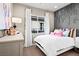 Charming bedroom with decorative wall art, bright pillows, and soft window lighting at 344 Tigullio Ave, Henderson, NV 89011