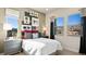 Cozy bedroom with modern decor, mountain view, large windows, and stylish accents at 344 Tigullio Ave, Henderson, NV 89011