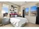 Cozy bedroom with modern decor, mountain view, large windows, and stylish accents at 344 Tigullio Ave, Henderson, NV 89011