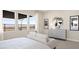 Bright bedroom with large windows offering scenic views, along with a dresser and artwork at 344 Tigullio Ave, Henderson, NV 89011