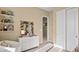 Neutral-toned room featuring a white dresser, shelves, and a closet with double doors at 344 Tigullio Ave, Henderson, NV 89011