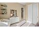 Neutral-toned room featuring a white dresser, shelves, and a closet with double doors at 344 Tigullio Ave, Henderson, NV 89011