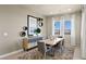 Inviting dining room featuring contemporary furnishings, natural light, and a view of the outdoors at 344 Tigullio Ave, Henderson, NV 89011