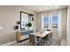 Elegant dining area with a stylish table, modern decor, and large windows showcasing scenic views at 344 Tigullio Ave, Henderson, NV 89011