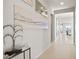 Bright hallway features light wood floors and contemporary decor at 344 Tigullio Ave, Henderson, NV 89011
