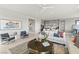 Bright living room with a modern kitchen, stylish furniture, and contemporary artwork creating a cozy ambiance at 344 Tigullio Ave, Henderson, NV 89011