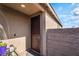 A front door with security screen next to a brick wall and a lush plant at 3782 Neblina Dr, Henderson, NV 89052
