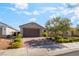 Charming single-story home with a two-car garage and a beautifully landscaped front yard at 3782 Neblina Dr, Henderson, NV 89052