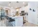 Bright kitchen featuring stainless steel appliances, white cabinets, and a stylish breakfast bar with seating at 3782 Neblina Dr, Henderson, NV 89052