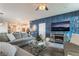 Comfortable living room featuring stylish decor, plush sofas, and a modern fireplace at 3782 Neblina Dr, Henderson, NV 89052