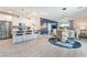 Open-concept living space with modern kitchen, dining area, and a cozy living room at 3782 Neblina Dr, Henderson, NV 89052