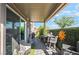 Inviting covered patio with outdoor furniture, lush greenery and shade from the desert sun at 3782 Neblina Dr, Henderson, NV 89052