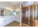 Bathroom features double sinks, updated vanity and fixtures, and luxurious shower at 379 Marlin Cove Rd, Henderson, NV 89012