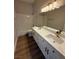 Updated bathroom features marble countertop, double sinks, modern fixtures, and a shower at 379 Marlin Cove Rd, Henderson, NV 89012