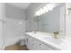 Bathroom featuring double sinks, tub and shower, and modern fixtures at 379 Marlin Cove Rd, Henderson, NV 89012