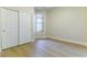 This is a bedroom with light hardwood floors, sliding door closet, and a window at 379 Marlin Cove Rd, Henderson, NV 89012