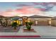 Charming single-story home featuring a well-manicured front yard with desert landscaping and a two-car garage at 379 Marlin Cove Rd, Henderson, NV 89012