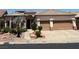 Charming single-story home featuring a two-car garage, desert landscaping, and a tile roof at 379 Marlin Cove Rd, Henderson, NV 89012