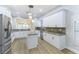 Bright kitchen with white cabinetry, granite countertops, stainless steel appliances, and an open layout at 379 Marlin Cove Rd, Henderson, NV 89012