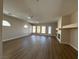 Open-concept living room with wood floors, recessed lighting, fireplace, and a fan at 379 Marlin Cove Rd, Henderson, NV 89012