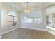 Bright living room with wood flooring, stylish lighting, and an open layout, creating a welcoming atmosphere at 379 Marlin Cove Rd, Henderson, NV 89012