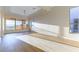 Main bedroom with light wood-look flooring and lots of light from large windows at 379 Marlin Cove Rd, Henderson, NV 89012