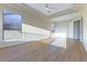 Bright main bedroom boasts natural light, wood-look flooring and a tray ceiling at 379 Marlin Cove Rd, Henderson, NV 89012