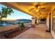 Spacious covered patio with multiple ceiling fans, offering a relaxing outdoor living space with views at 379 Marlin Cove Rd, Henderson, NV 89012