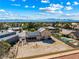 Expansive aerial view showcasing a home with solar panels, a large backyard, and a pool in a residential neighborhood at 3930 Maranatha Cir, Las Vegas, NV 89103