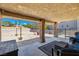 Inviting back porch offers a relaxing outdoor seating area and a view of the spacious backyard at 3930 Maranatha Cir, Las Vegas, NV 89103