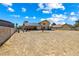 Expansive backyard ideal for recreation and relaxation under the blue sky and scattered clouds at 3930 Maranatha Cir, Las Vegas, NV 89103