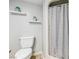 Bathroom featuring white toilet, shelving and tiled shower stall at 3930 Maranatha Cir, Las Vegas, NV 89103