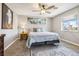 Comfortable bedroom features a large window for natural light and plush carpet at 3930 Maranatha Cir, Las Vegas, NV 89103