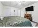 This bedroom offers decorative chests, wood flooring and a ceiling fan at 3930 Maranatha Cir, Las Vegas, NV 89103