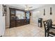 This dining area features a ceiling fan, tile flooring and a built in buffet and bar at 3930 Maranatha Cir, Las Vegas, NV 89103