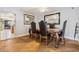 The dining room features wood floors, decorative furniture, and ample natural light for comfortable meals at 3930 Maranatha Cir, Las Vegas, NV 89103