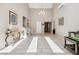 Spacious foyer with high ceilings, neutral walls, and bright tile flooring at 3930 Maranatha Cir, Las Vegas, NV 89103
