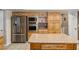 Modern kitchen with stainless steel appliances and ample storage, featuring a granite island at 3930 Maranatha Cir, Las Vegas, NV 89103