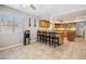 Cozy eat-in kitchen with granite countertops, a kitchen island, and a window view at 3930 Maranatha Cir, Las Vegas, NV 89103
