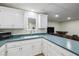 The kitchen's countertops, ample cabinetry, and appliances create an efficient and stylish workspace at 3930 Maranatha Cir, Las Vegas, NV 89103