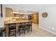 Inviting eat-in kitchen with granite countertops, a kitchen island, and ample cabinet space at 3930 Maranatha Cir, Las Vegas, NV 89103