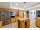 Open kitchen featuring stainless steel appliances, ample cabinet space and granite countertops at 3930 Maranatha Cir, Las Vegas, NV 89103