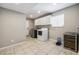Spacious laundry room with white cabinets and stainless steel washer and dryer at 3930 Maranatha Cir, Las Vegas, NV 89103